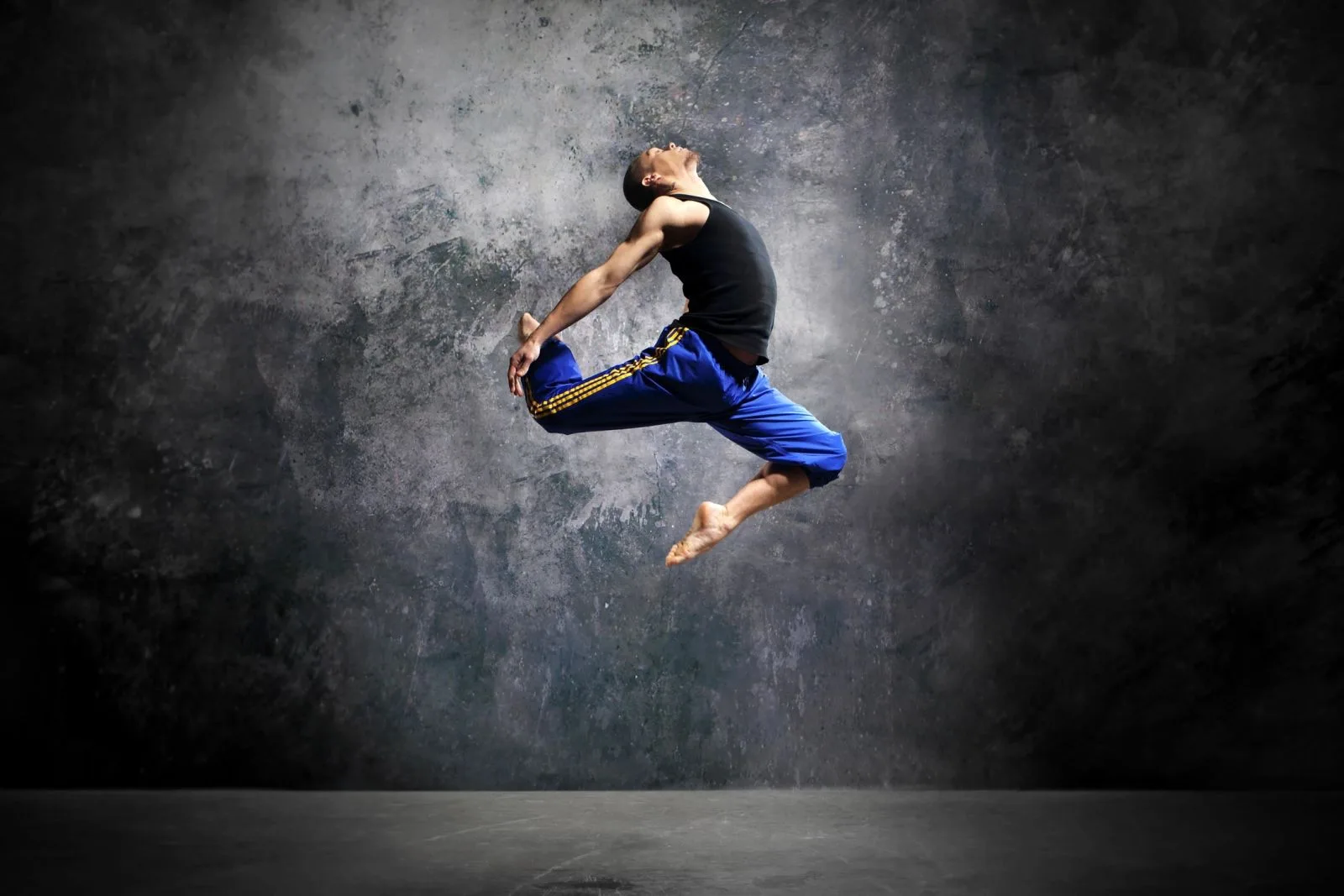 A dancer captured mid-leap, the artistry and passion behind The JM Dental